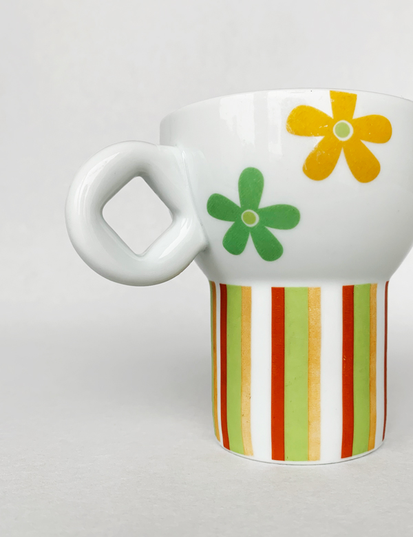 The green happy cup with focus on handle