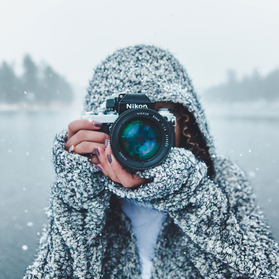 A photographer in a winter landscape.